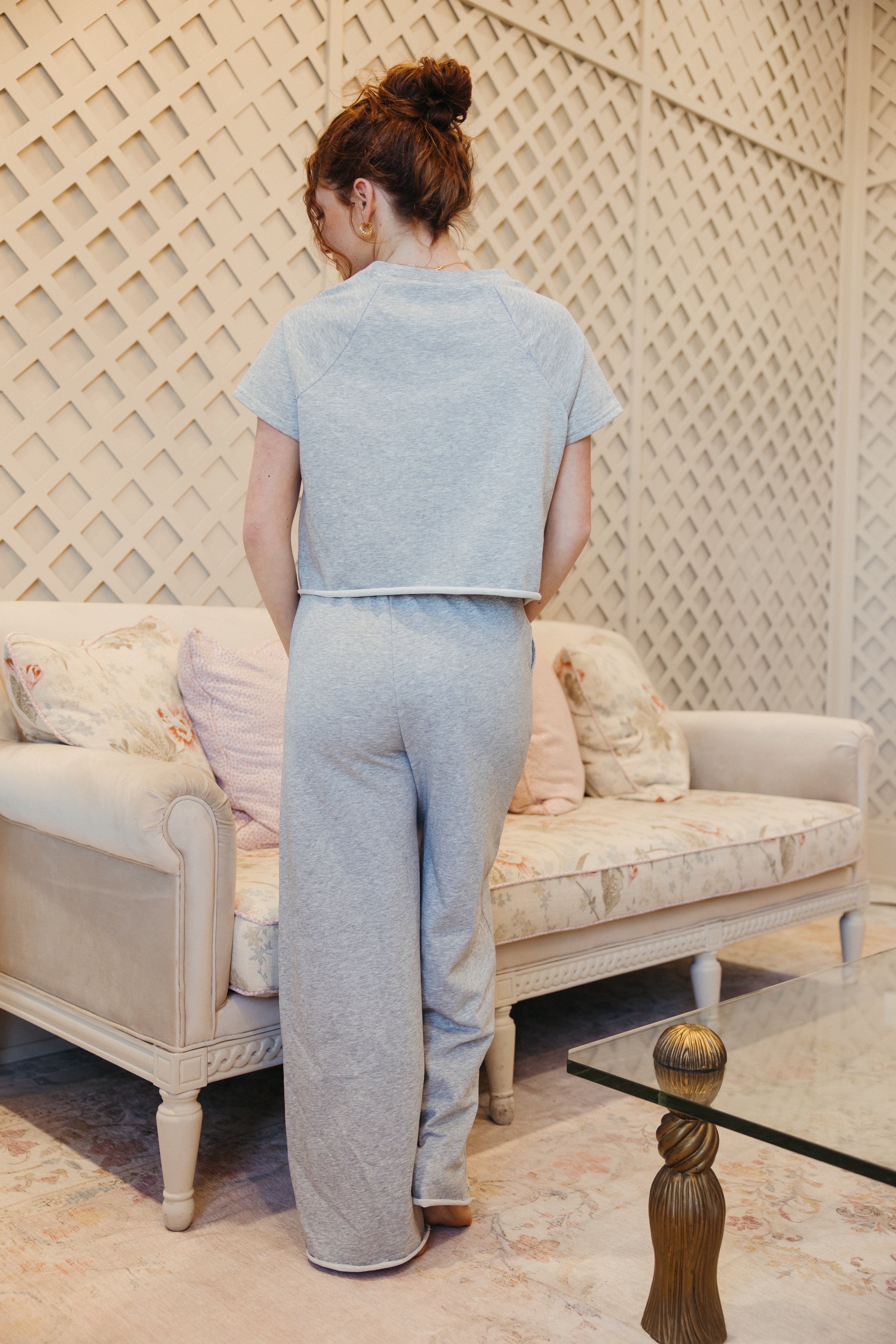 Model is wearing comfy short sleeve and pant set.
