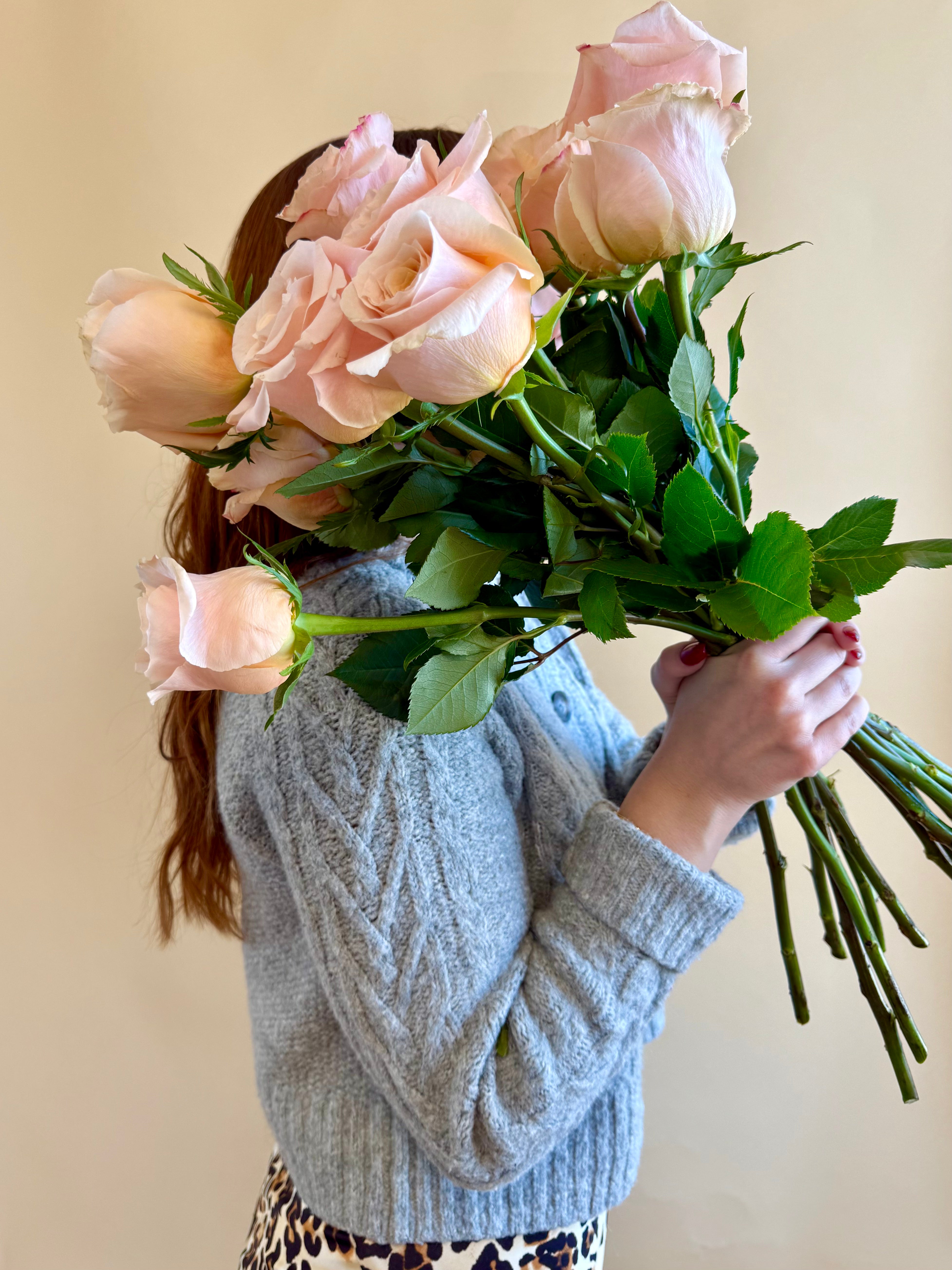 Product shoot of a dozen peach roses.