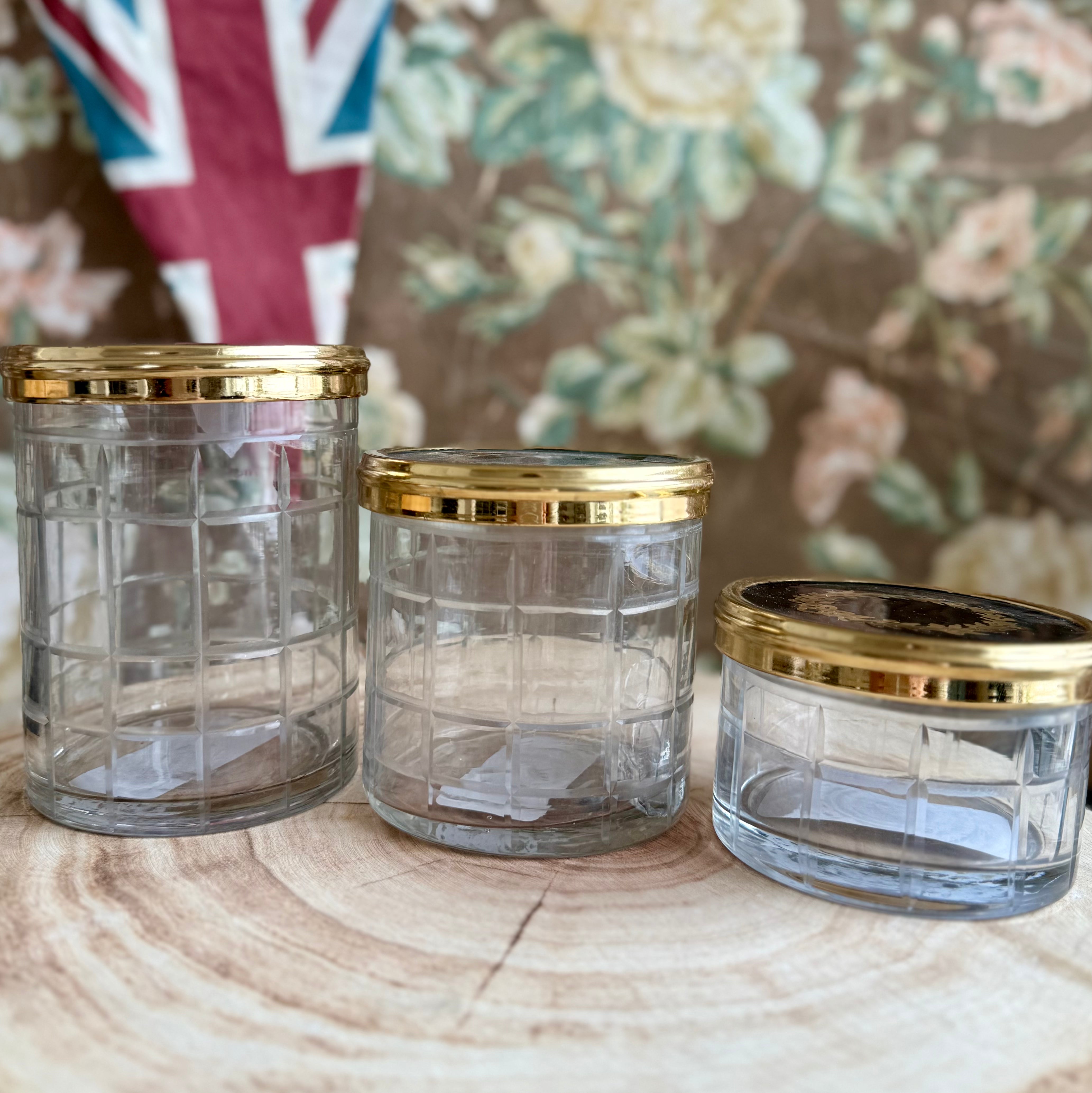 Product shoot of gold and glass crown jar.