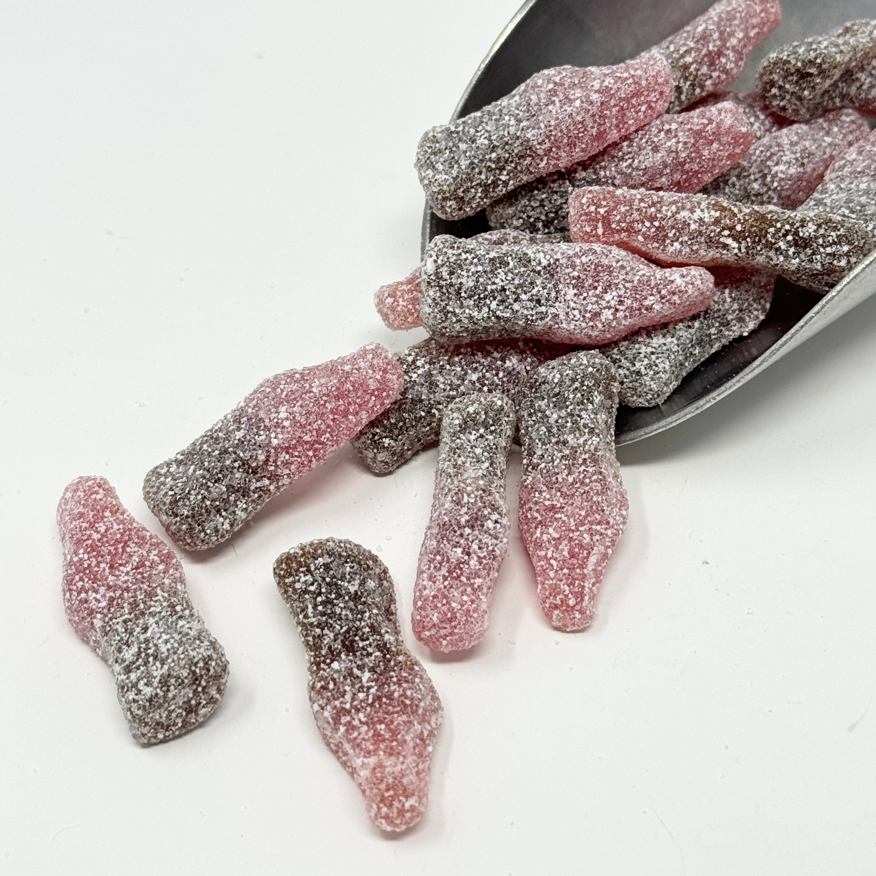 Sour sugared cherry cola candy in a scoop