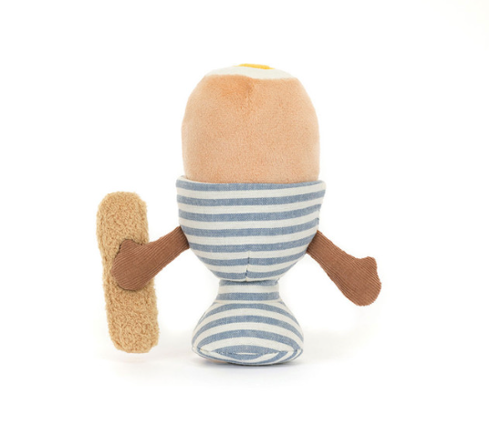 Plush toy egg and French baguette with face and hands holding eachother