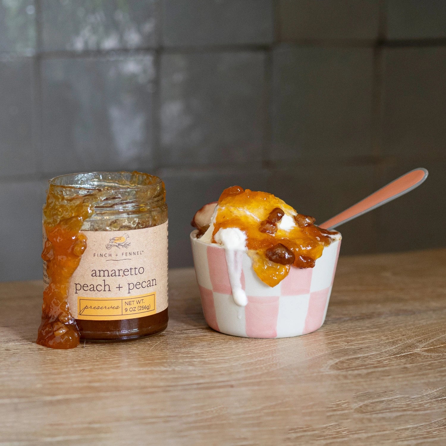 Product shoot of amaretto peach and pecan preserves container. 