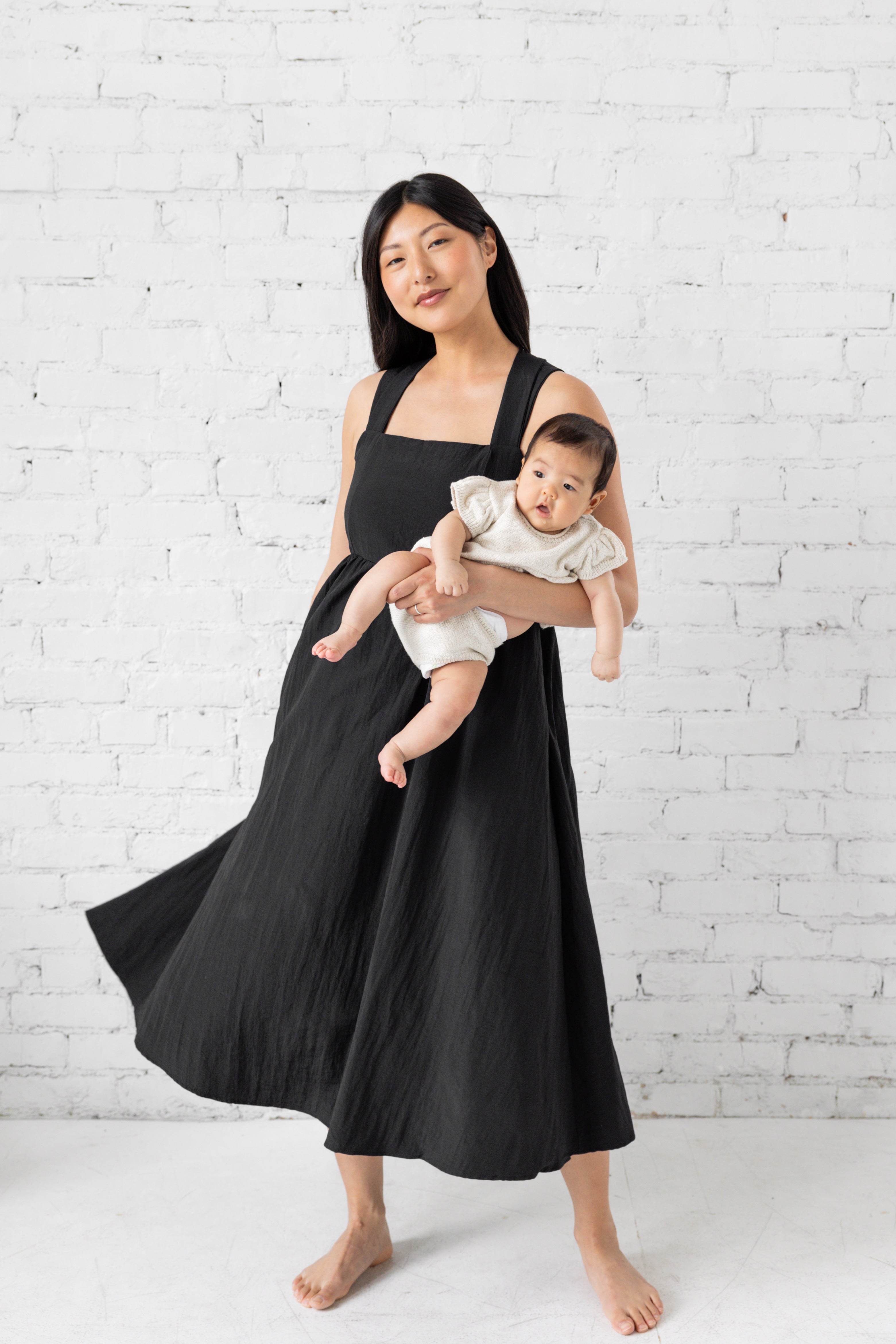 Model is wearing square neck tank top midi loose dress. 
