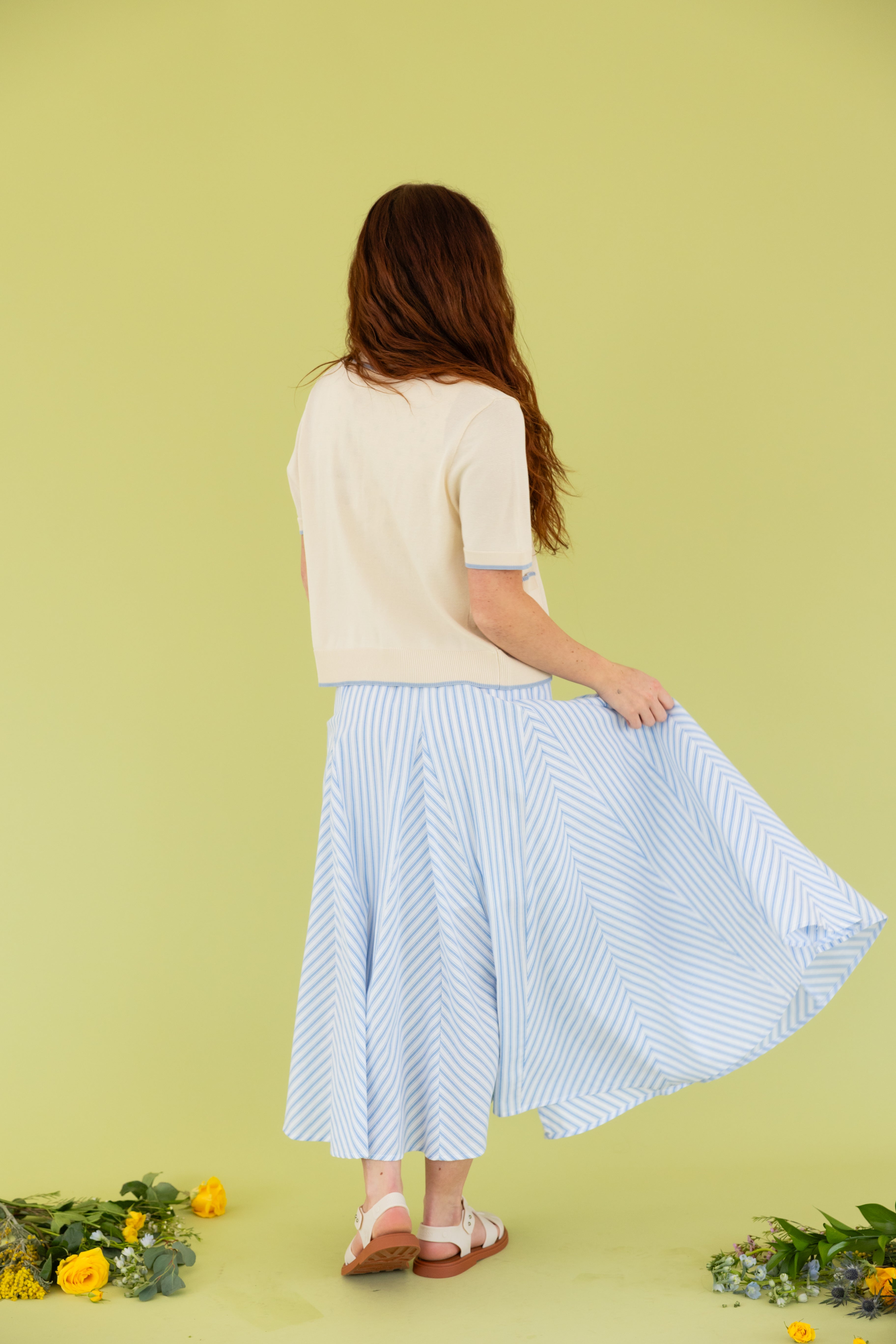 Model wearing a blue midi skirt 