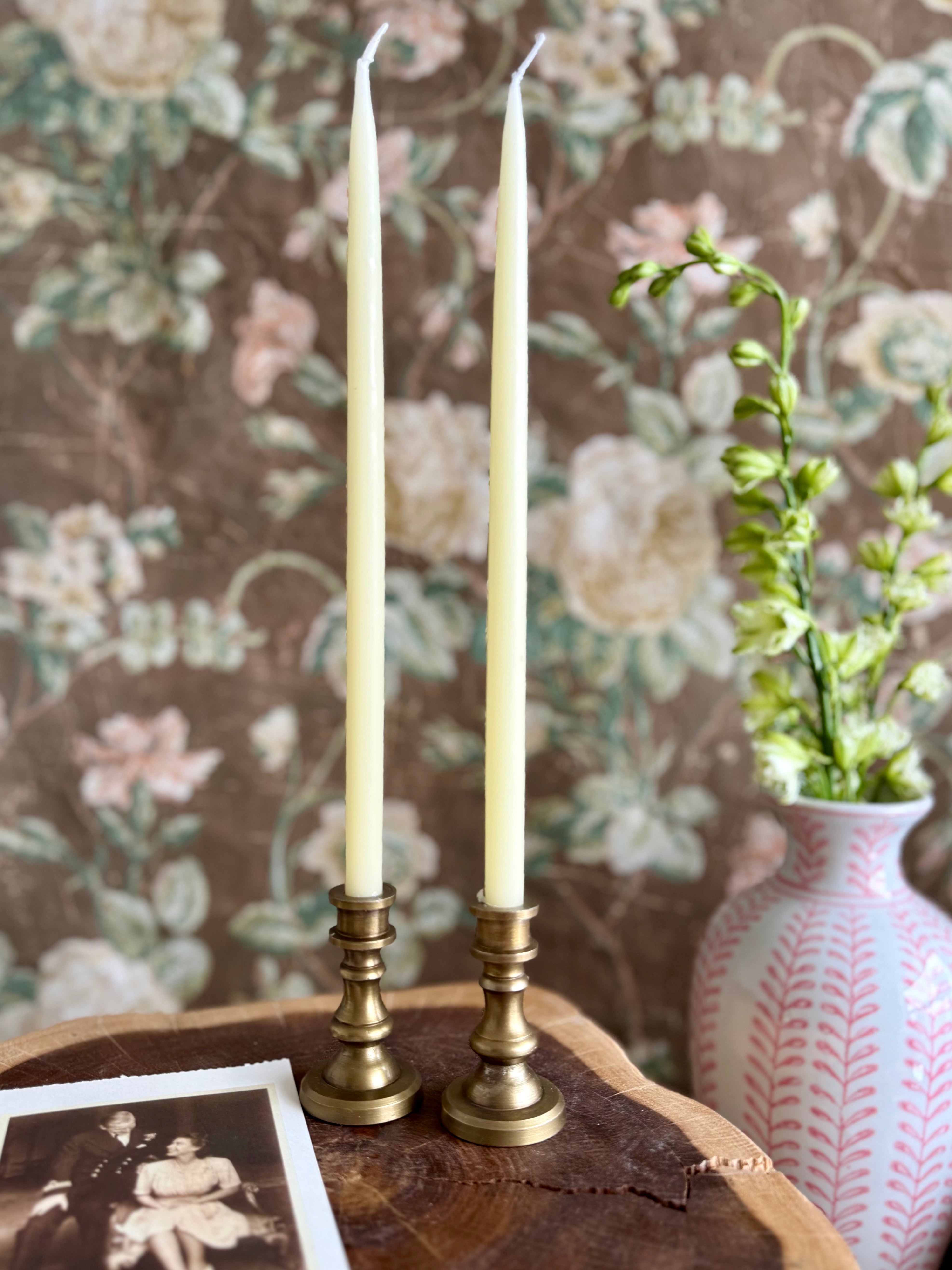Product shoot of antique brass taper holder.