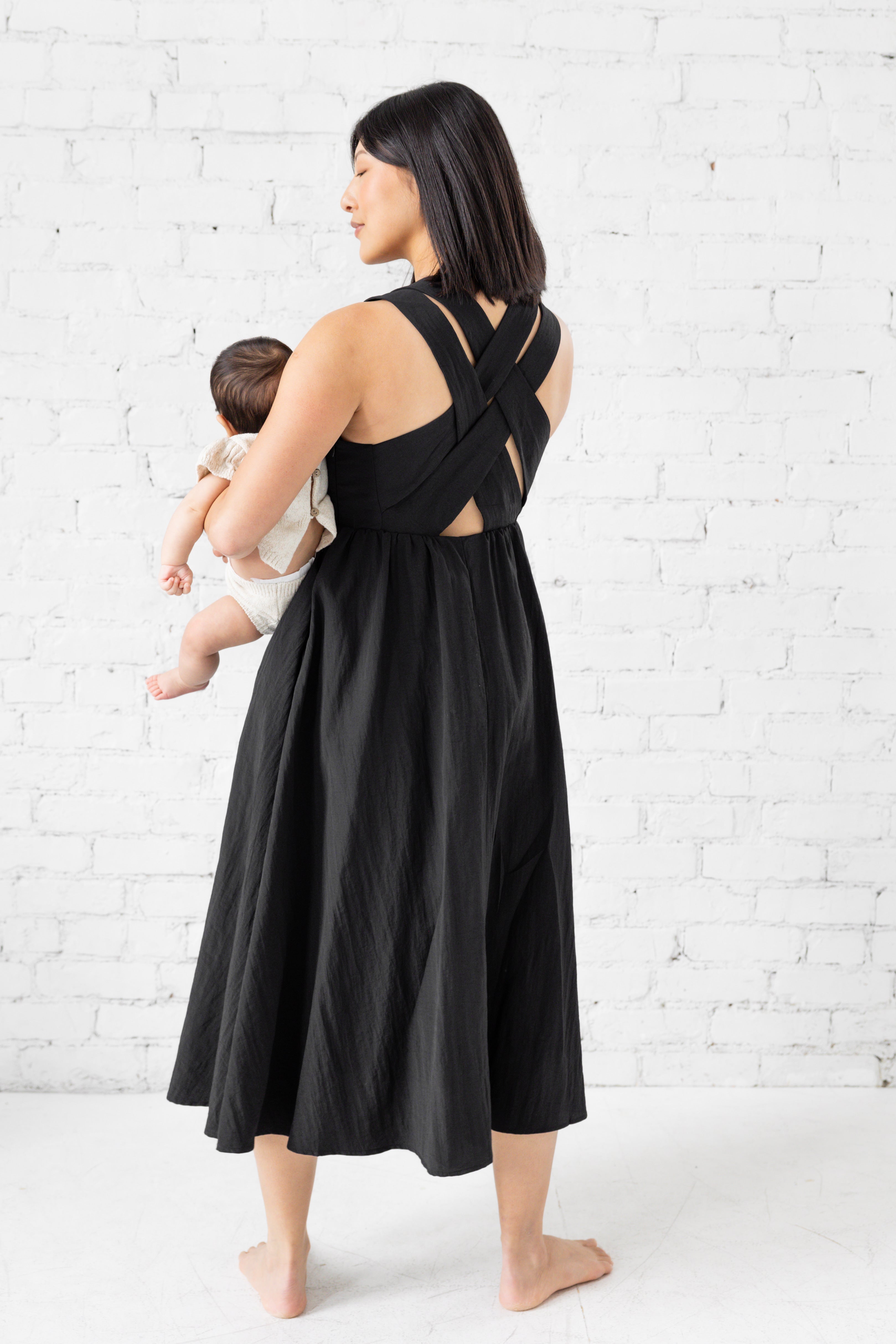 Model is wearing square neck tank top midi loose dress. 