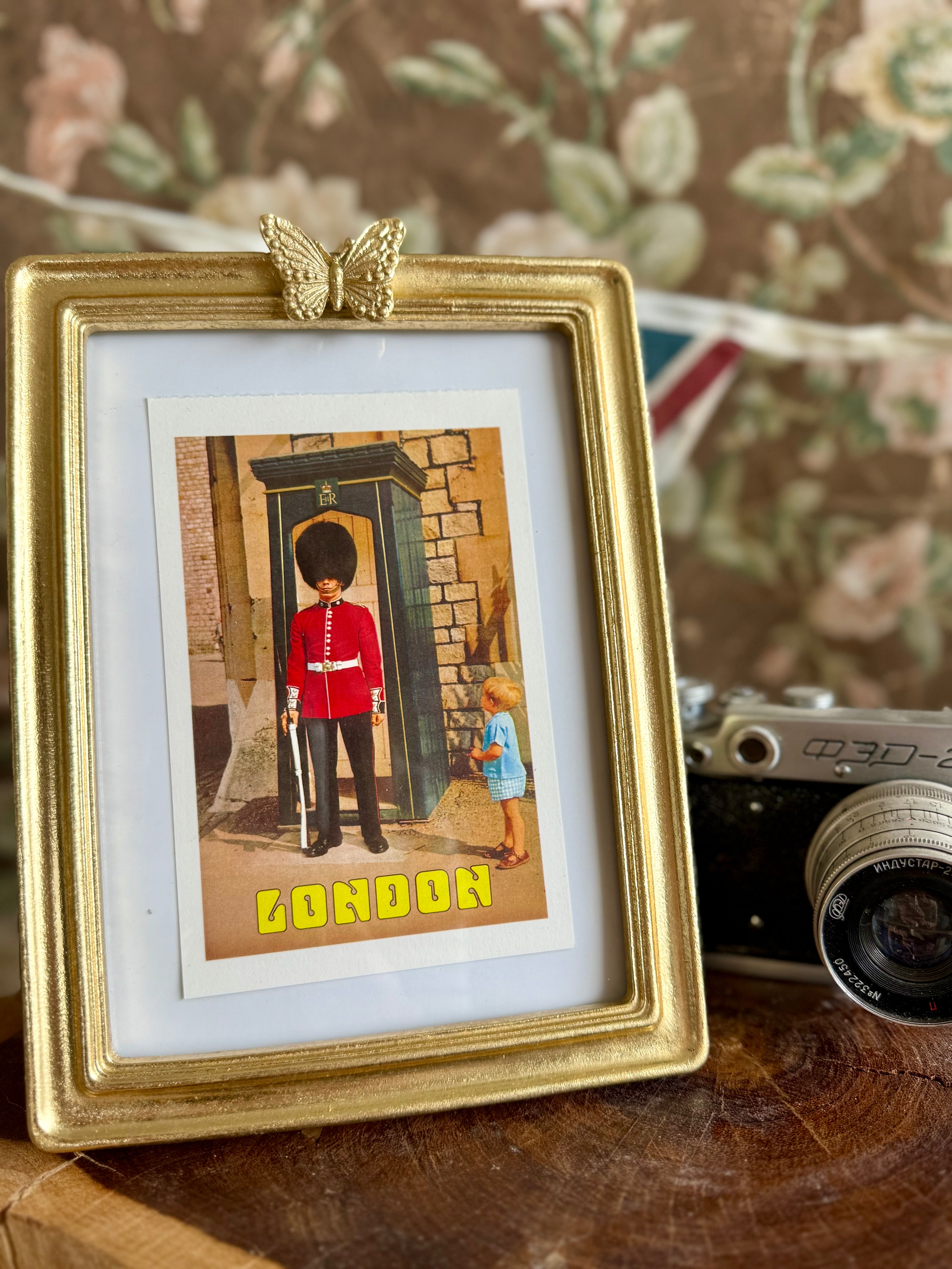 Product shoot of butterfly gold vintage photo frame.