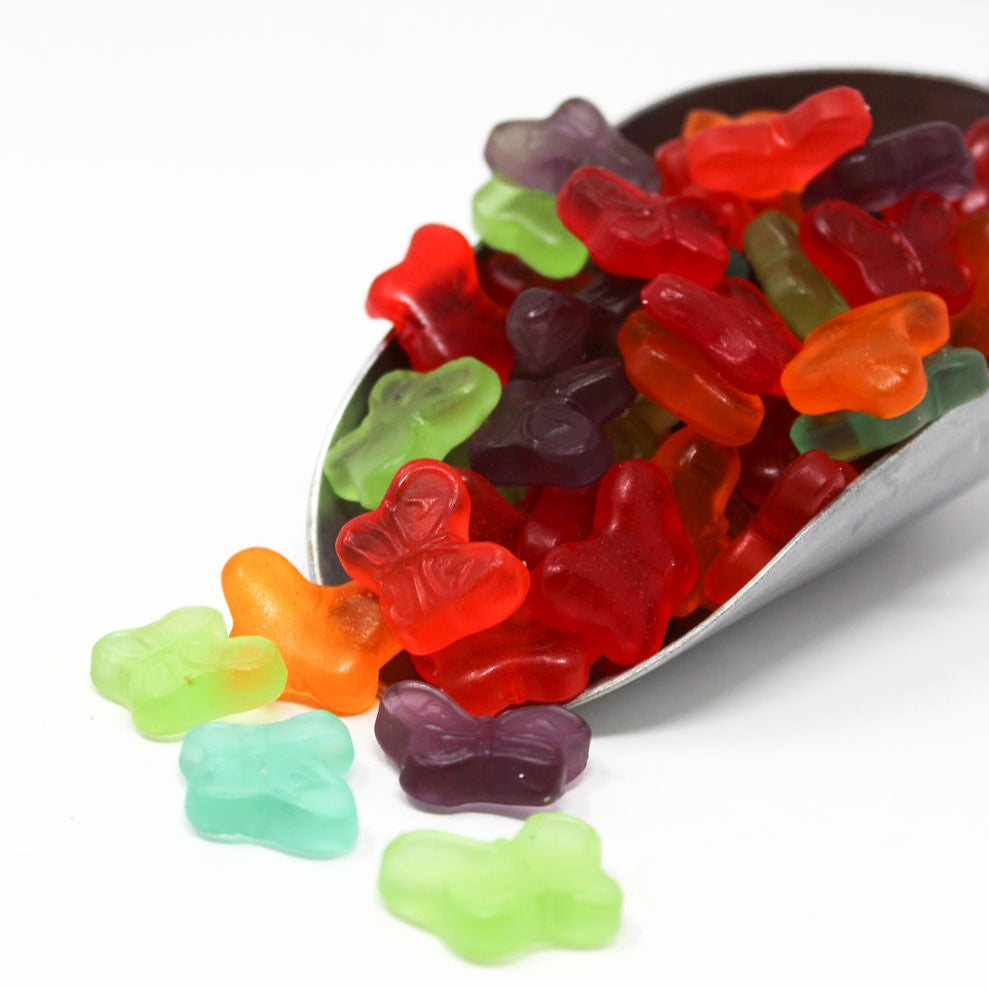 Product shoot of multi colored gummy butterflies. 