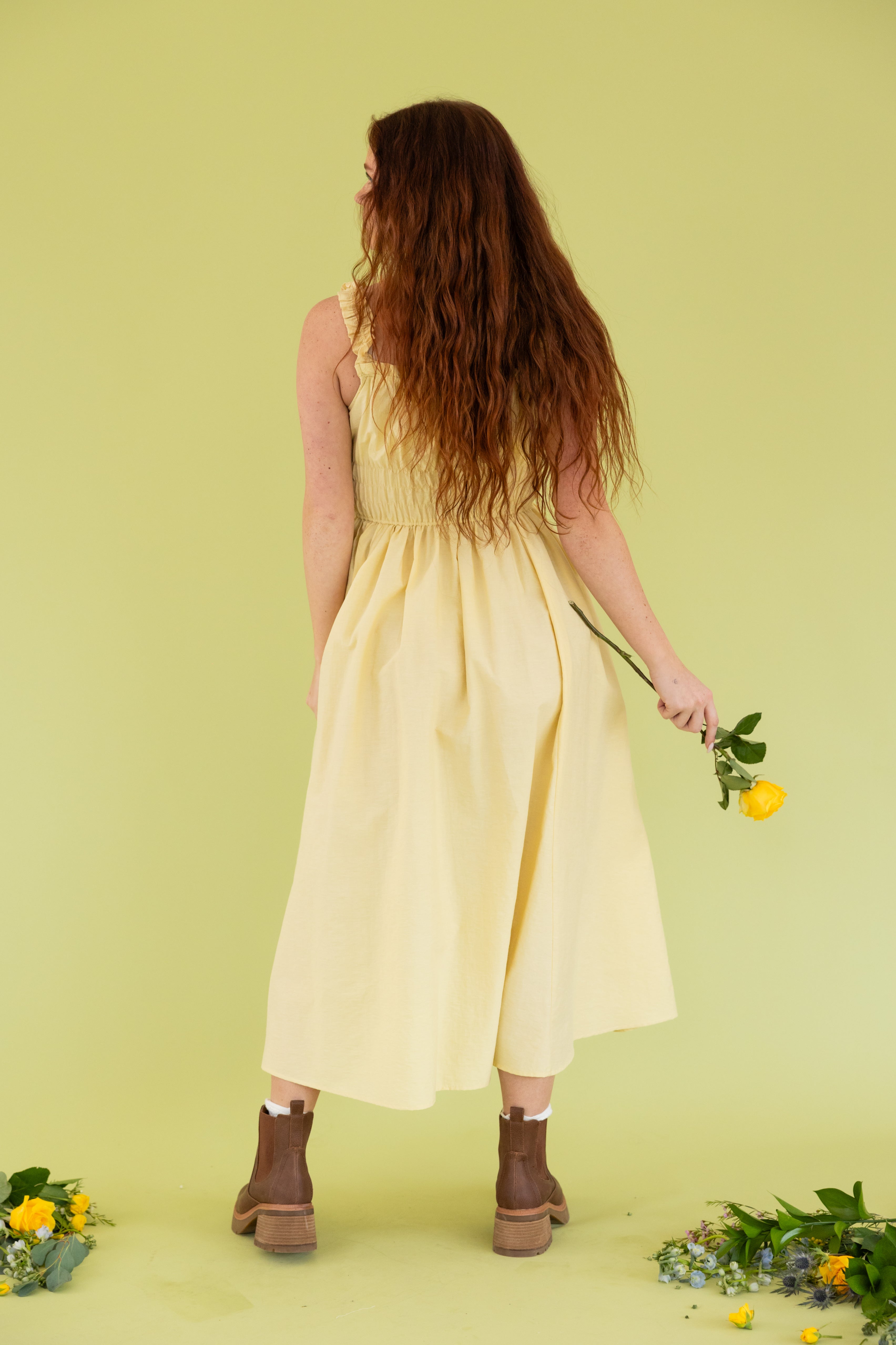 Model is wearing midi tank yellow dress