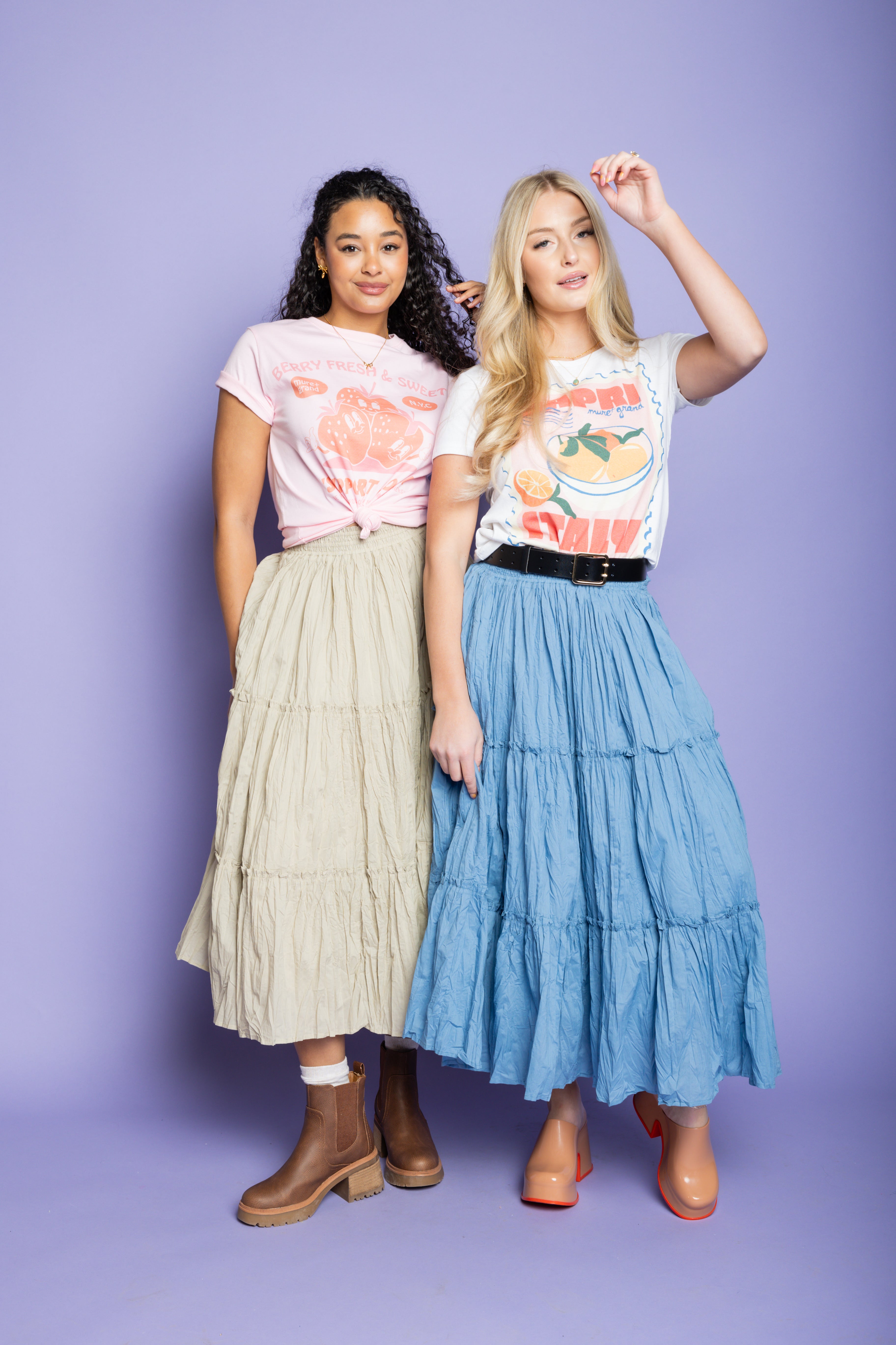 Model is wearing Italian t-shirt with ruffled maxi skirt.