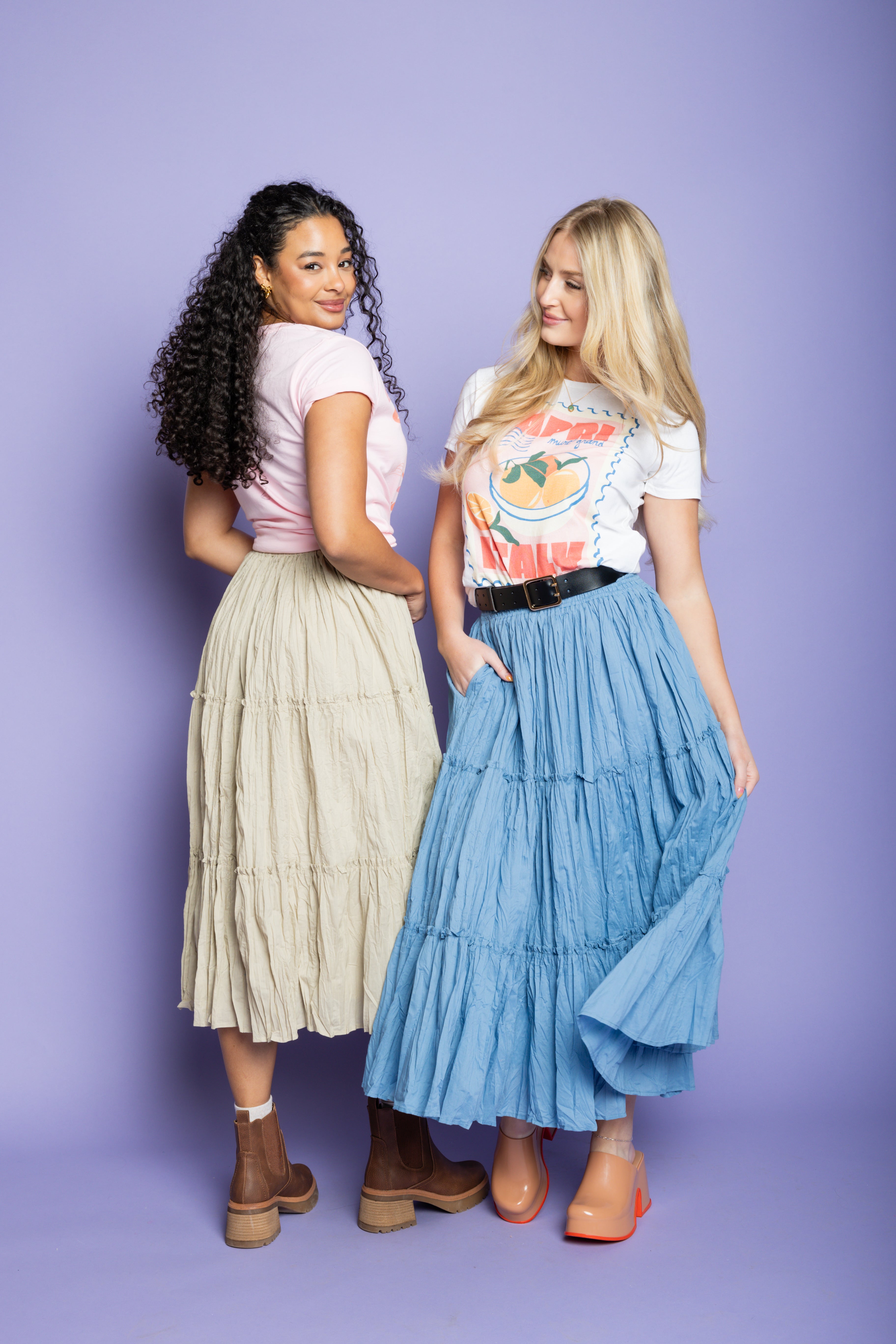 Model wearing an Italian t-shirt and flowy tiered maxi skirt. 