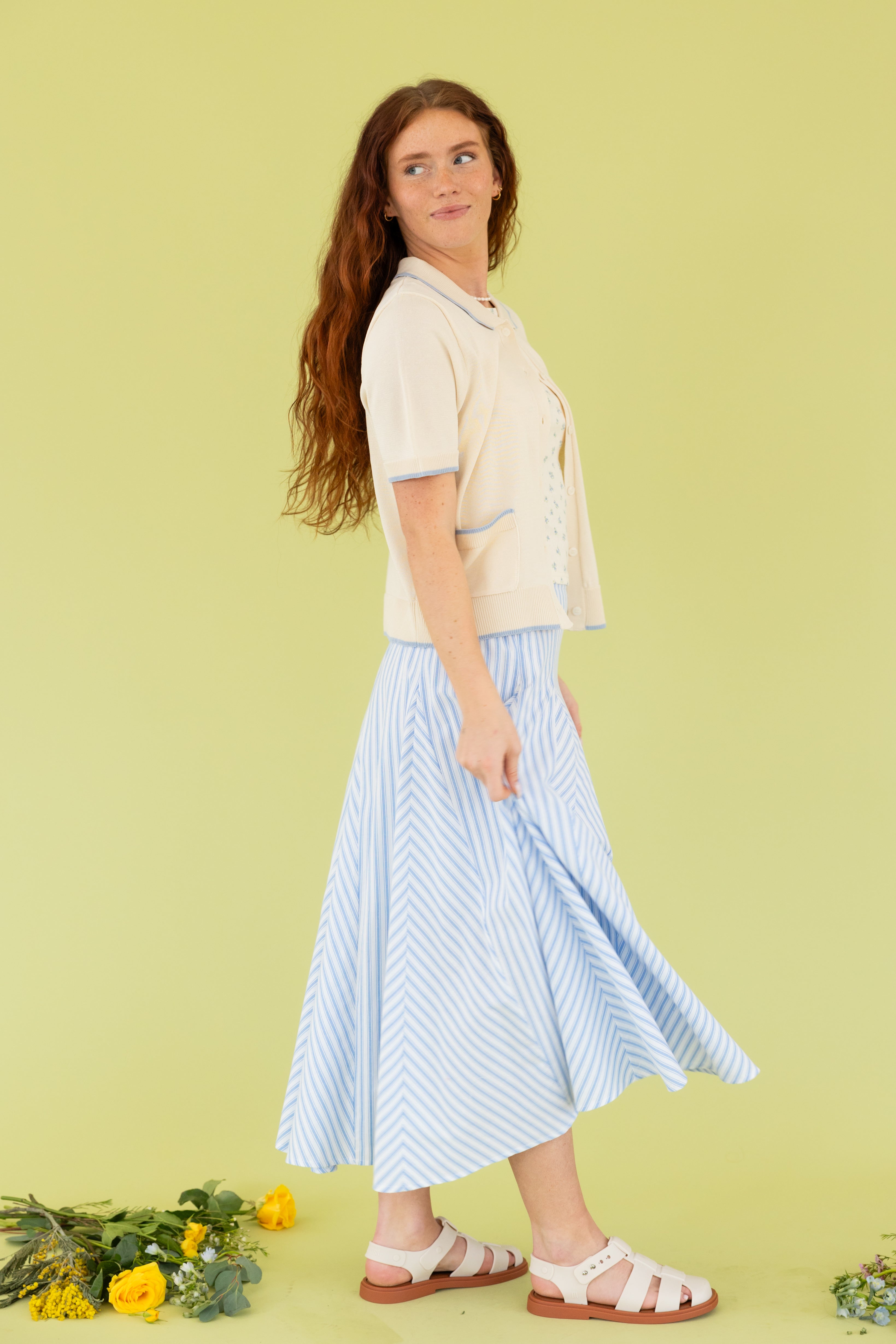 Model wearing a blue midi skirt 