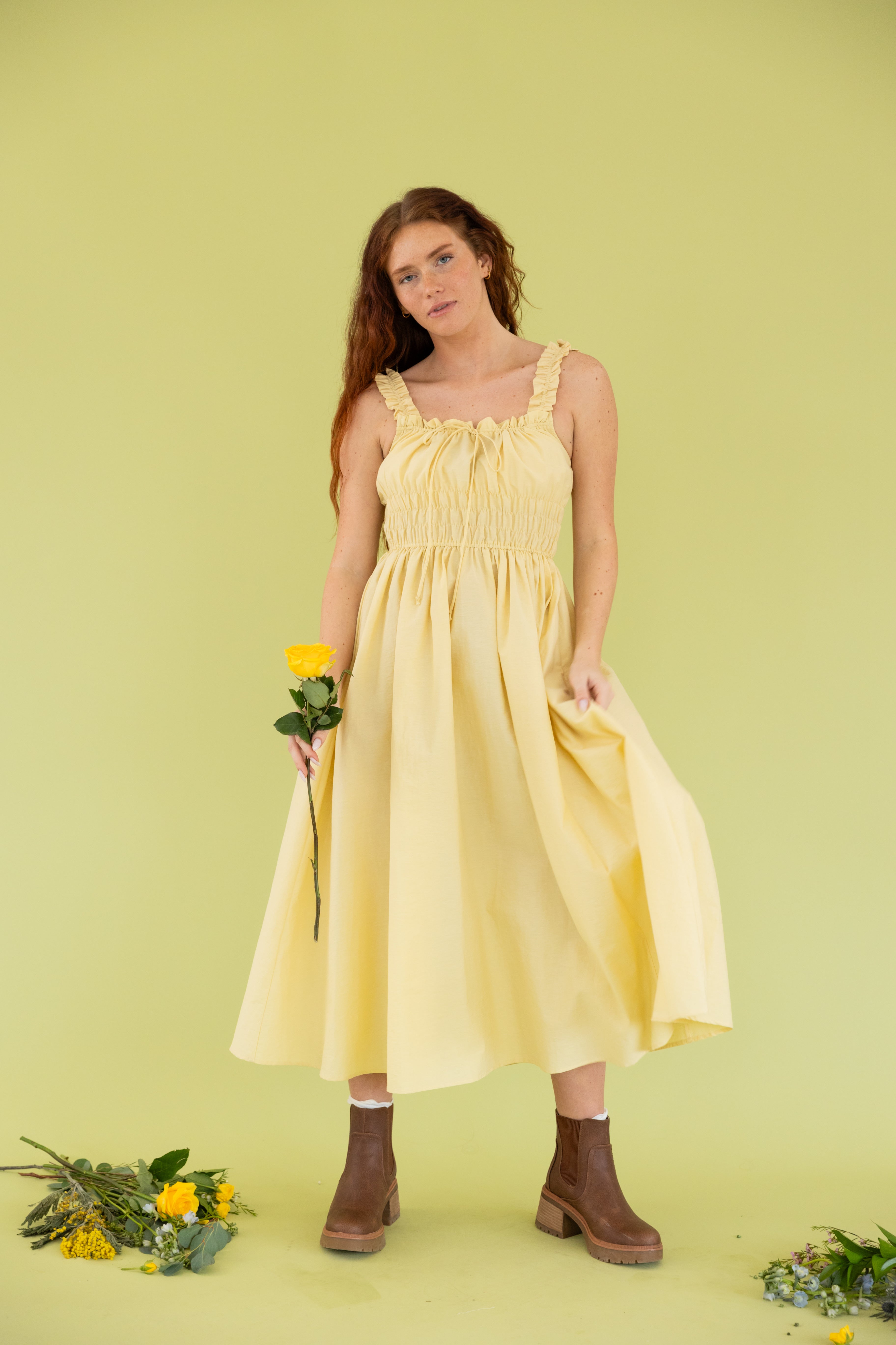 Model is wearing midi tank yellow dress 