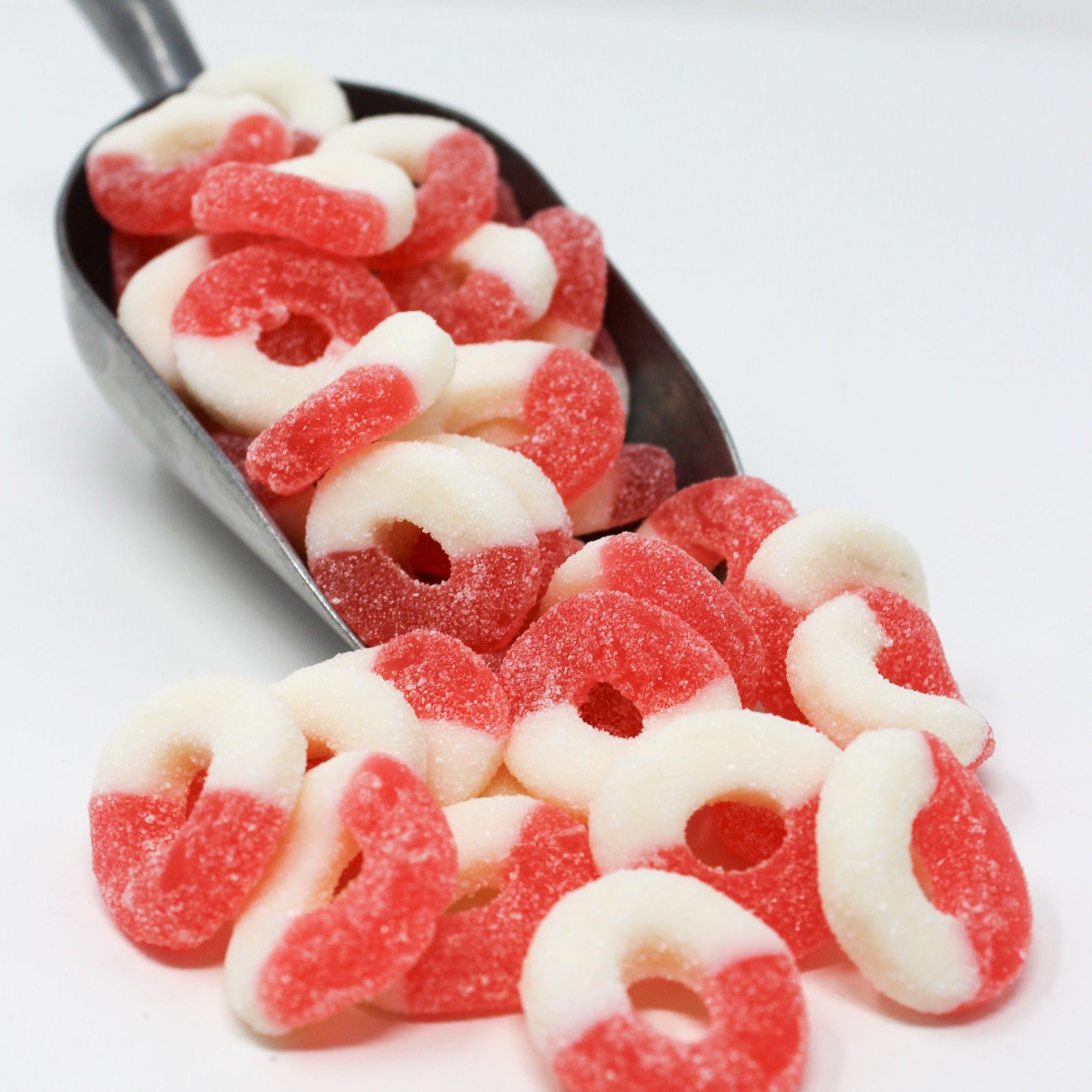 Sugared watermelon rings with half white and pink.