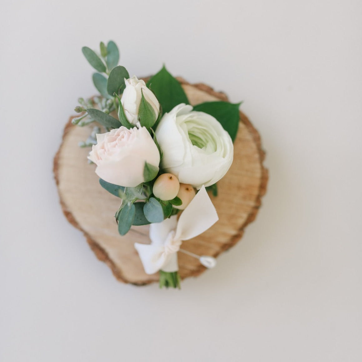 White and cream boutonnieres