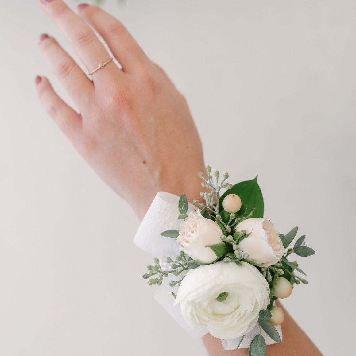 Beautiful corsages made with seasonal mixed flowers.
